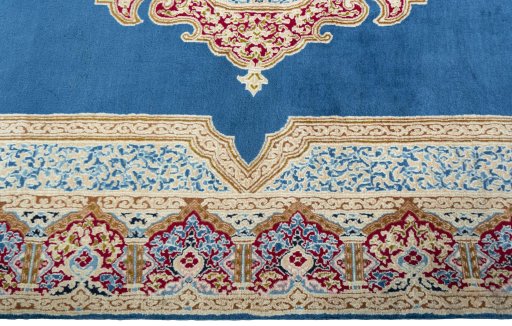 Corner detail of 2000s Kerman rug showing border pattern and Wool pile
