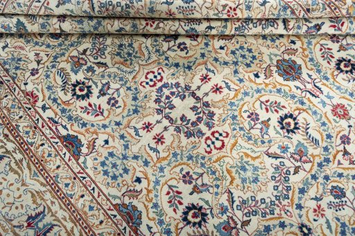 Corner detail of 1950s Kashan rug showing border pattern and Wool pile