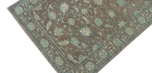 Backside of handmade New Farahan rug showing knot structure and weave density