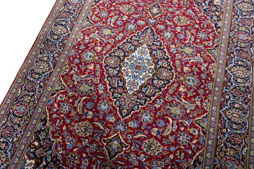 Backside of handmade New Kashan rug showing knot structure and weave density