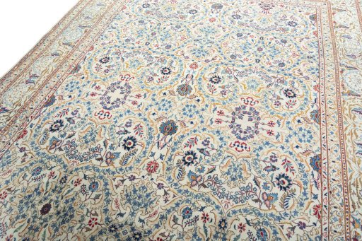 Backside of handmade 1950s Kashan rug showing knot structure and weave density