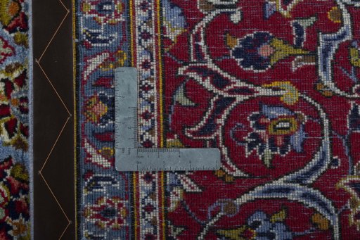 Backside of handmade 2000s Kashan rug showing knot structure and weave density