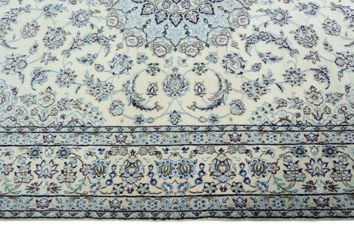 Corner detail of 2000s Nain rug showing border pattern and Wool pile