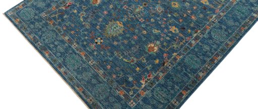 Backside of handmade New Farahan rug showing knot structure and weave density