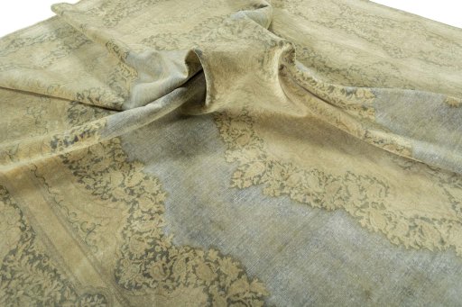 Surface texture of 1970s Vintage rug with natural Wool and intricate pattern