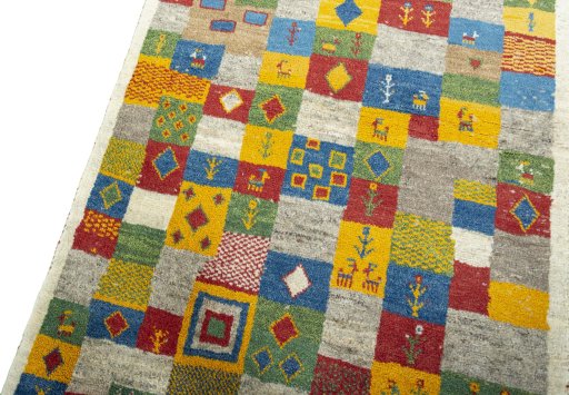 Backside of handmade 2000s Persian Gabbeh rug showing knot structure and weave density