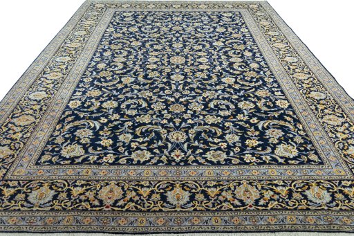 Surface texture of 2000s Kashan rug with natural Wool and intricate pattern