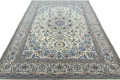 Surface texture of 2000s Nain rug with natural Wool and intricate pattern