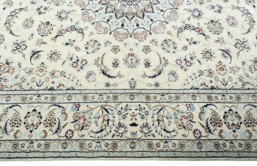 Corner detail of 2000s Nain rug showing border pattern and Wool pile