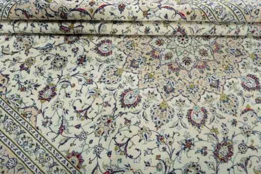 Close-up detail of 2000s Kashan rug from Iran / Persia showing Wool weave