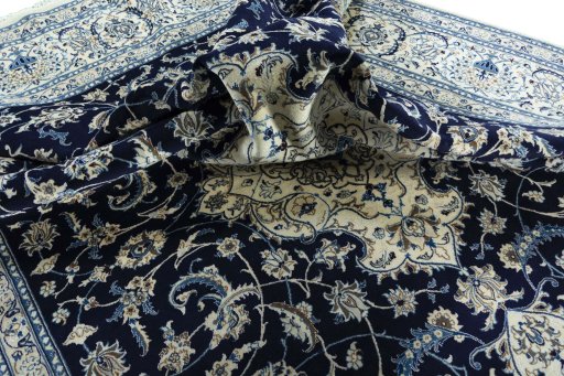 Surface texture of 2000s Nain rug with natural Wool and intricate pattern