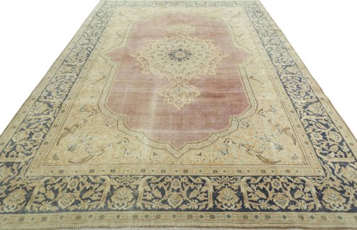 Surface texture of 1950s Vintage rug with natural Wool and intricate pattern