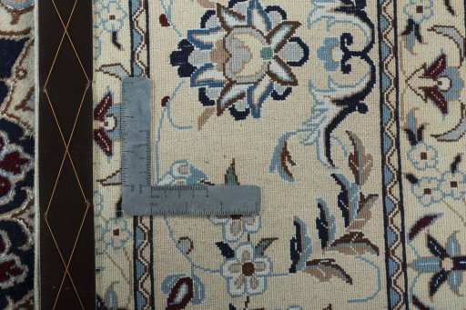 Backside of handmade New Nain rug showing knot structure and weave density
