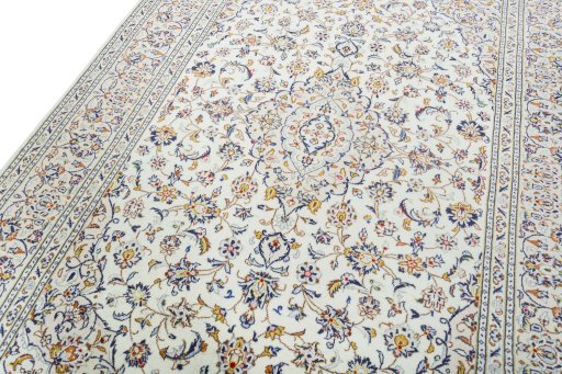 Backside of handmade 2000s Kashan rug showing knot structure and weave density