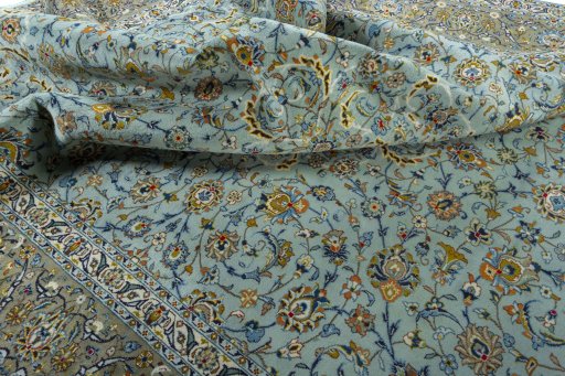 Surface texture of 2000s Kashan rug with natural Wool and intricate pattern