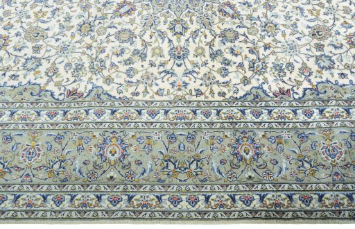 Corner detail of New Kashan rug showing border pattern and Cork pile