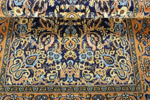 Corner detail of 1970s Ghom rug showing border pattern and Wool pile