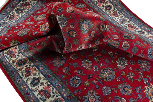Surface texture of 2000s Sarough rug with natural Wool and intricate pattern