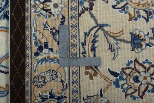 Backside of handmade 2000s Nain rug showing knot structure and weave density