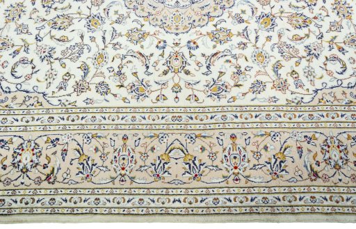 Corner detail of 2000s Kashan rug showing border pattern and Wool pile