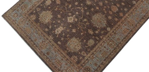 Backside of handmade New Farahan rug showing knot structure and weave density