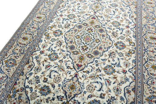 Backside of handmade 2000s Kashan rug showing knot structure and weave density