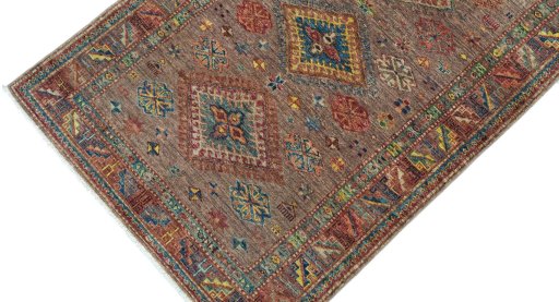 Backside of handmade New Kazak rug showing knot structure and weave density