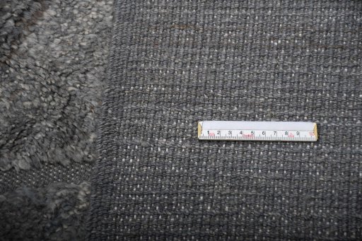 Backside of handmade New Morocco rug showing knot structure and weave density