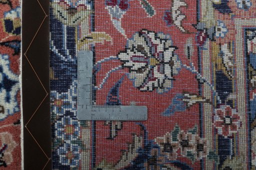 Backside of handmade 2000s Kashan rug showing knot structure and weave density