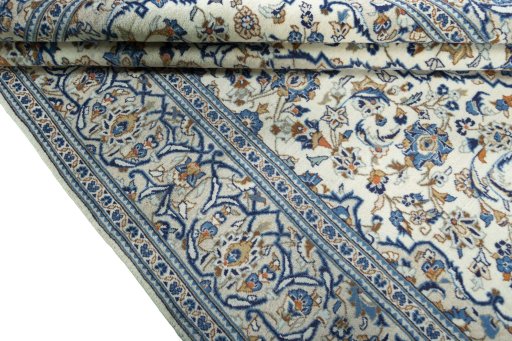 Close-up detail of 2000s Kashan rug from Iran / Persia showing Wool weave