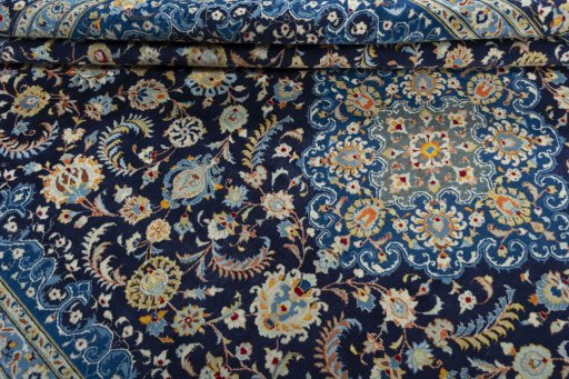 Close-up detail of 2000s Kashan rug from Iran / Persia showing Wool weave