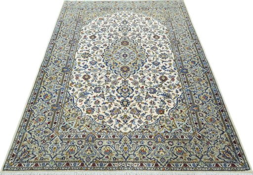 Surface texture of 2000s Kashan rug with natural Cork and intricate pattern