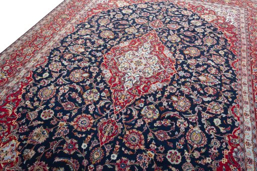 Backside of handmade 2000s Kashan rug showing knot structure and weave density
