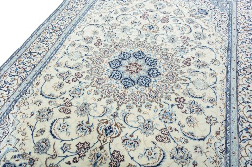 Backside of handmade New Nain rug showing knot structure and weave density