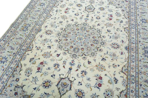 Backside of handmade 2000s Kashan rug showing knot structure and weave density