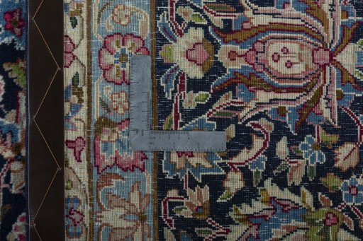 Backside of handmade 1970s Kerman rug showing knot structure and weave density
