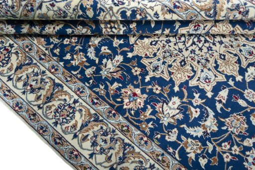 Close-up detail of 2000s Nain rug from Iran / Persia showing Wool weave