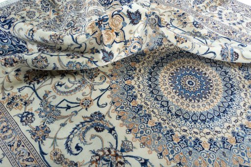 Surface texture of 2000s Nain rug with natural Wool and intricate pattern