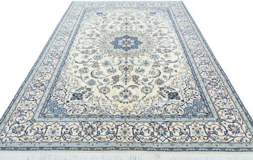 Surface texture of 2000s Nain rug with natural Wool and intricate pattern