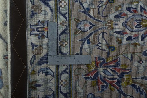 Backside of handmade 2000s Kashan rug showing knot structure and weave density