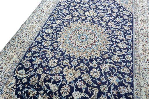 Backside of handmade New Nain rug showing knot structure and weave density