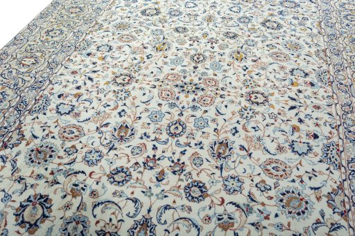 Backside of handmade 2000s Kashan rug showing knot structure and weave density