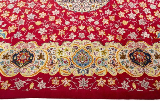 Corner detail of 2000s Kashan rug showing border pattern and Wool pile