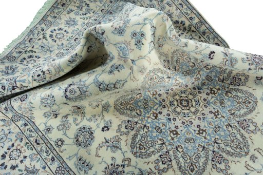 Surface texture of 2000s Nain rug with natural Wool and intricate pattern