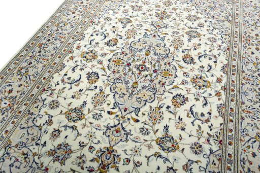 Backside of handmade 2000s Kashan rug showing knot structure and weave density