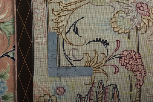 Backside of handmade 2000s Tabriz 50/60/70 Raj rug showing knot structure and weave density