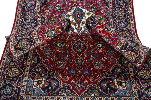 Surface texture of 2000s Kashan rug with natural Wool and intricate pattern