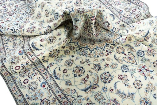Surface texture of 2000s Nain rug with natural Wool and intricate pattern