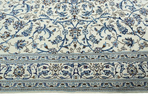 Corner detail of 2000s Nain rug showing border pattern and Wool pile