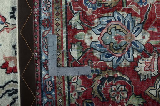 Backside of handmade 1970s Sarough rug showing knot structure and weave density